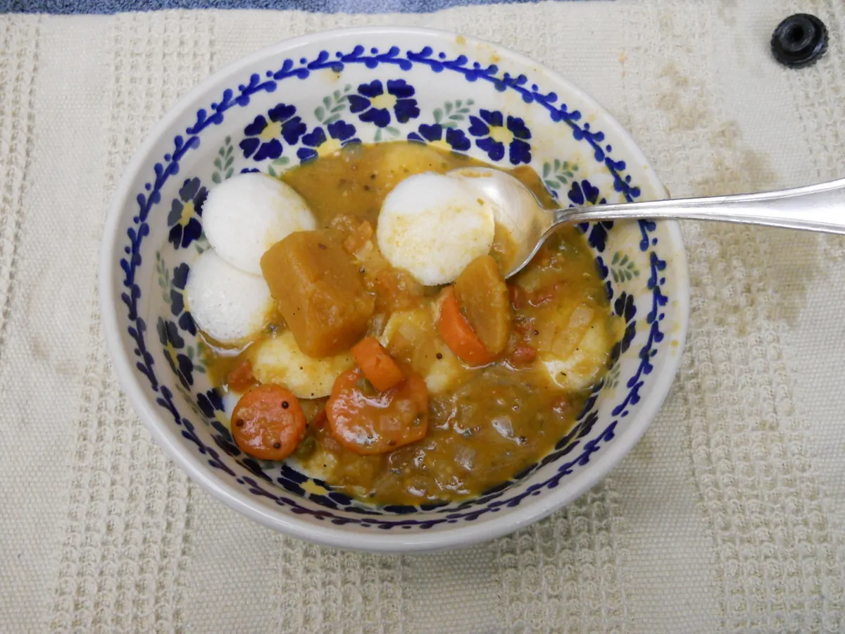 Mini idlis soaked in South Indian sambar